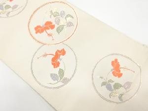 丸に花模様織り出し名古屋帯